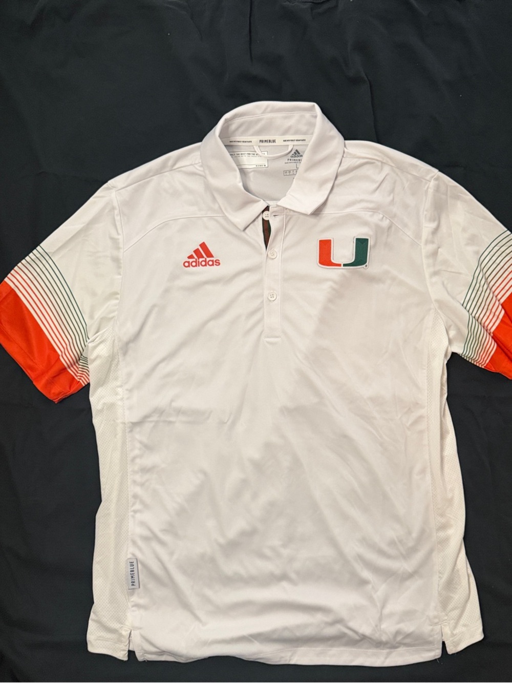 Adidas Miami UM Men’s White Polo with Orange Sleeve Accents and U Logo-Primeblue